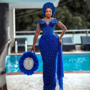 Royal Sapphire Crystal Wrapper Gown with Gele and Feather Fan